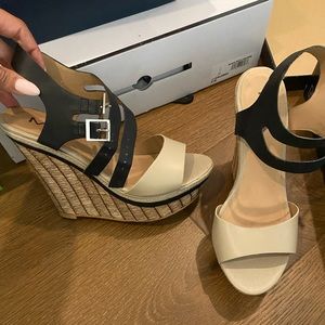 Beige and black wedges